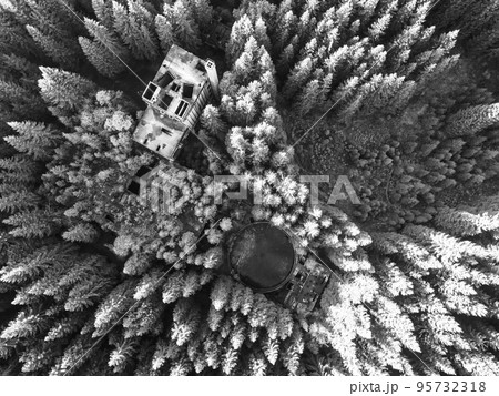Ruins of former tin mine in the forest from above 95732318