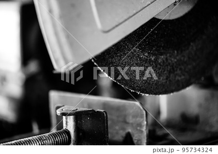 Selective focus on chop saw abrasive blade used for cutting metal. 95734324