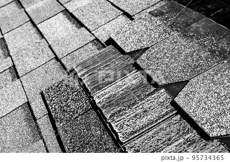 Assorted selection of premium synthetic roof shingles to pick a new style. 95734365