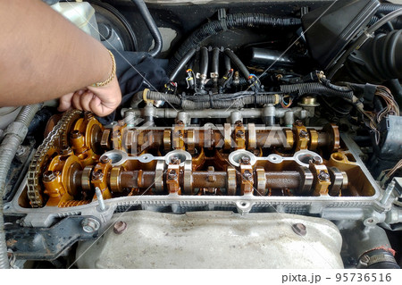 Close up of parts in engine head for adjust valve engine Close up of parts in engine head for adjust valve engine 95736516