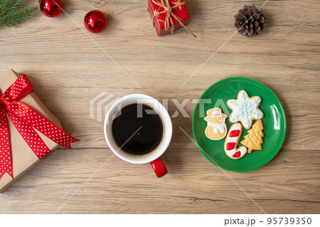 Merry Christmas with homemade cookies and coffee cup on wood table background. Xmas eve, party, holiday and happy New Year concept 95739350