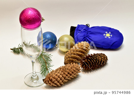 Glass balls decoration for the Christmas tree, wine glass and fir cones. 95744986