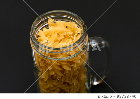 Uncooked Fusilli Pasta in Glass Jar 95753740