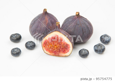fresh figs and blueberries on a white background. Vitamin products fresh figs and blueberries on a white background. Vitamin products 95754775