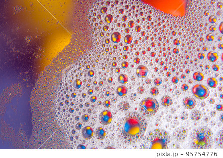 abstract colored balls of oily liquid on a blurred background abstract colored balls of oily liquid on a blurred background 95754776