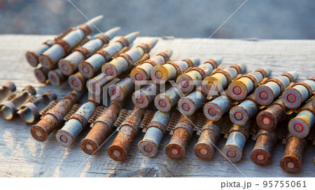 old rusty cartridges in a machine-gun belt. war in Ukraine. military ammunition old rusty cartridges in a machine-gun belt. war in Ukraine. military ammunition 95755061