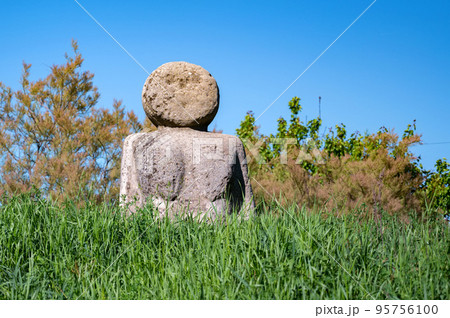 Gods idol statue. Statue on the background of nature. Gods idol statue. Statue on the background of nature. 95756100