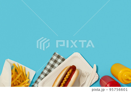 Traditional hot dogs, french fries, drink and sauces. Restaurant menu 95756601