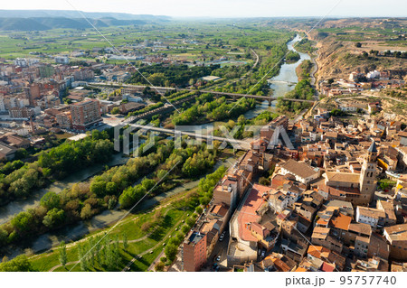 Drone view of two parts of Fraga divided by Cinca river 95757740