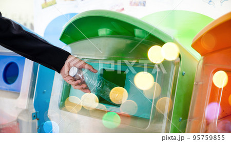 World Environment Day concept. Business woman throwing empty plastic bottle water into recycle garbage trash or bin, Waste management environmental recycling concept World Environment Day concept. Business woman throwing empty plastic bottle water into recycle garbage trash or bin, Waste management environmental recycling concept 95759855
