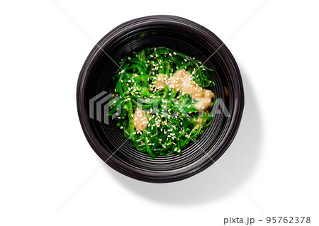 Japanese dish of spicy pickled hiyashi seaweeds with peanut sauce and sesame 95762378