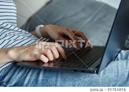 Working from home concept. Woman jands typing on laptop keyboard. Remote work from home workplace 95763858