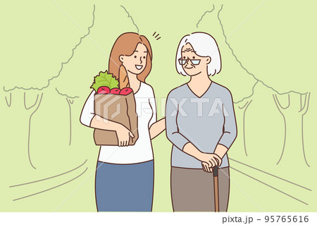 Girl with groceries help old grandmother  95765616