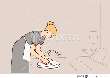 Housekeeper working in hotel room Housekeeper working in hotel room 95765627