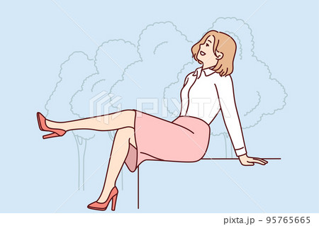 Smiling woman sitting outside in park  95765665