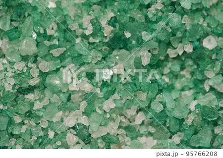 Texture of sea salt white and green color in close-up. Body treatment, skin care concept. Texture of sea salt white and green color in close-up. Body treatment, skin care concept. 95766208