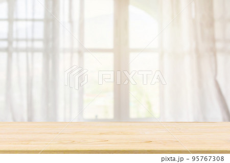 Empty wood table top with window curtain abstract blur background for product display 95767308