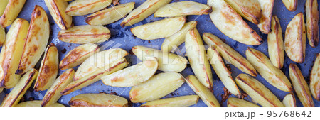 Baked apples with sugar cut into slices closeup 95768642