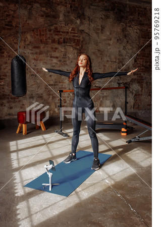 Portrait of a young female online trainer 95769218