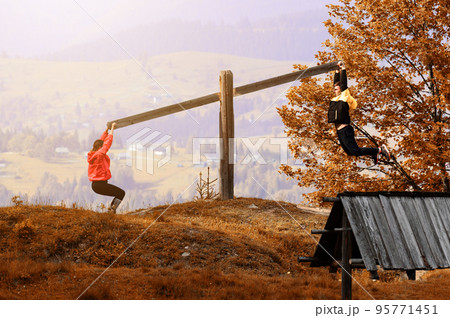A colorful swing for two in the Carpathians, Carpathian landscapes. Autumn landscape in the forest. A colorful swing for two in the Carpathians, Carpathian landscapes. Autumn landscape in the forest. 95771451