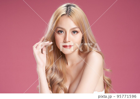 Beautiful young asian woman with clean fresh skin on pink background, Face care, Facial treatment, Cosmetology, beauty and spa, Asian women portrait. Beautiful young asian woman with clean fresh skin on pink background, Face care, Facial treatment, Cosmetology, beauty and spa, Asian women portrait. 95771596
