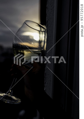 Vine glass in woman hand. 95772018