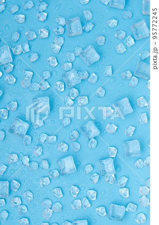 Ice cubes with water drops on blue background. 95772245