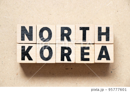 Alphabet letter block in word north korea on wood background 95777601