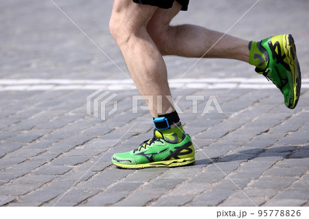 foot running distance athlete on the stone pavement 95778826