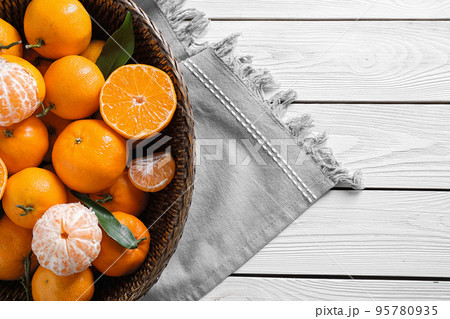 Fresh ripe tangerines on white wooden table, top view Fresh ripe tangerines on white wooden table, top view 95780935