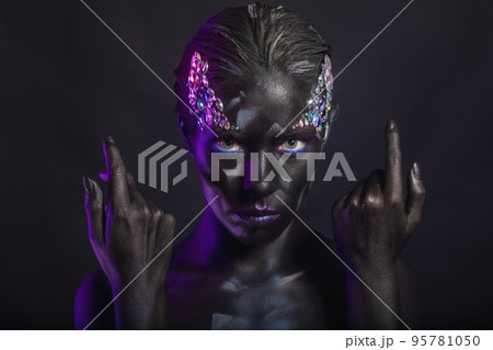 Lovely brunette with creative makeup on face 95781050