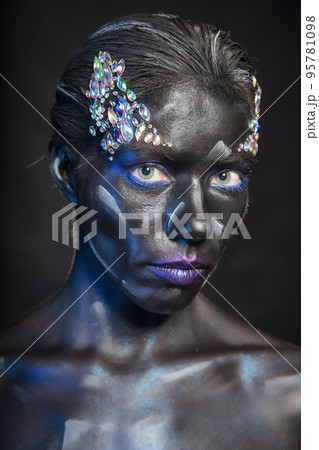 Portrait of cute woman with makeup on face Portrait of cute woman with makeup on face 95781098