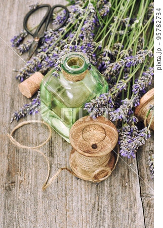 Lavender flowers herbal oil bottle rustic vintage wooden background Lavender flowers herbal oil bottle rustic vintage wooden background 95782734