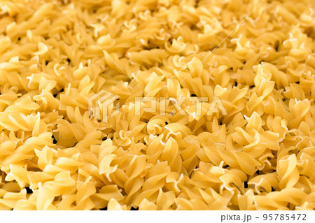 Uncooked Fusilli Pasta - Texture Background Uncooked Fusilli Pasta - Texture Background 95785472
