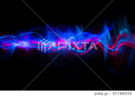 Abstract technology banner design. Long exposure, light painting. Vibrant streaks of digital neon lines on black background. 95786939