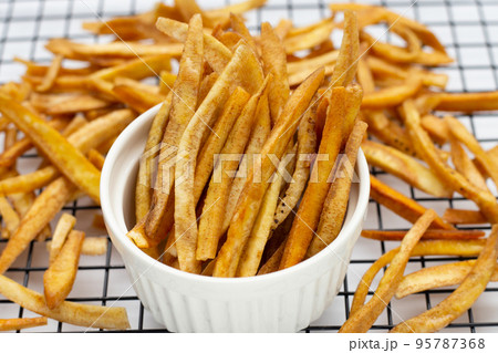 Crispy banana sticks. Fruit snack Crispy banana sticks. Fruit snack 95787368