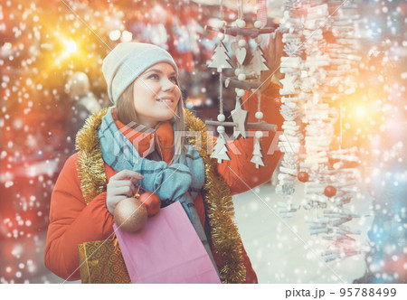 Woman shopping on Christmas market Woman shopping on Christmas market 95788499