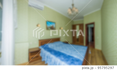 Defocused and blurred photo of luxury and modern bedroom with sea view in hotel apartment interior design. Ideal for background. 95795297
