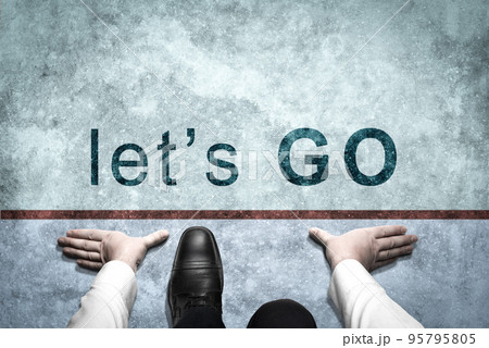 Businessman ready to start on starting line with inscription Let's Go. man ready to start. successful business way. Businessman get ready on starting on road. Start Let's Go line. Business start 95795805