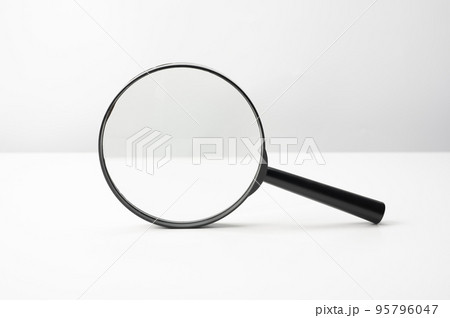 Magnifying glass black color on white table. Research, searching or investigating something. front view Magnifying glass Magnifying glass black color on white table. Research, searching or investigating something. front view Magnifying glass 95796047