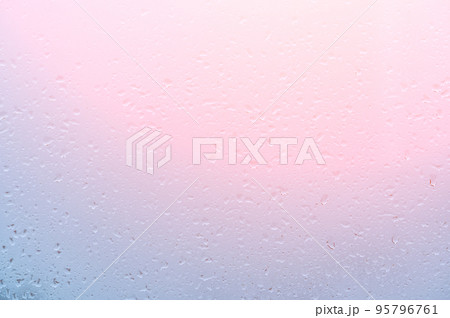 Water Drops Background. Rain drops on window on sunset, pink blue background. drop of water on glass in a pink glow. pink background drops glass abstract texture 95796761