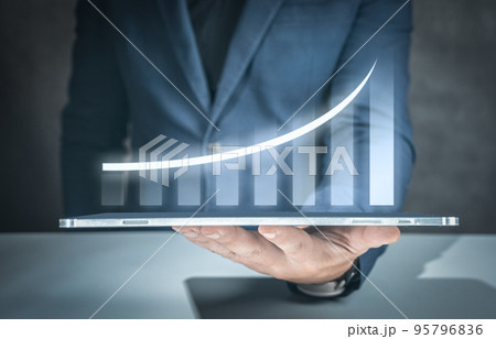 Businessman with report chart up forward to financial profit growth of stock market investment. Development and growth concept. Businessman plan growth and increase of positive indicators in business. 95796836