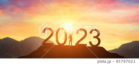 2023. Welcome Happy new year 2023. Man meets dawn in mountains. happy New Year 2023. New Start motivation inspirational quote message on silhouette of winner woman 2023. Welcome Happy new year 2023. Man meets dawn in mountains. happy New Year 2023. New Start motivation inspirational quote message on silhouette of winner woman 95797021