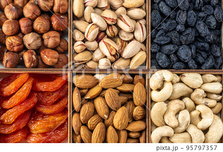 assorted nuts and dried fruit collection. Assorted nuts almonds, pistachio, cashews, walnut. Organic mixed nuts background. Healthy food, useful microelements and vitamins. assorted nuts and dried fruit collection. Assorted nuts almonds, pistachio, cashews, walnut. Organic mixed nuts background. Healthy food, useful microelements and vitamins. 95797357