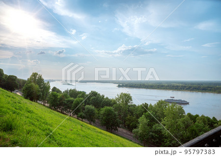 River and hill on sunny summer day landscape. Summertime landscape. Beautiful river surrounded by hills on sunny day Lush green foliage 95797383