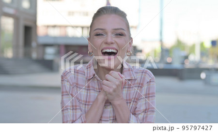 Portrait of Excited Young Woman Screaming Outdoor Portrait of Excited Young Woman Screaming Outdoor 95797427