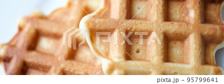 Homemade Belgian sugar waffles on plate closeup 95799641