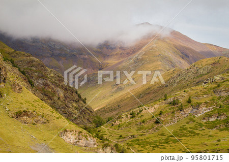 Cloudy day in a Spanish Pyrenees mountain, near Vall de Nuria valley Cloudy day in a Spanish Pyrenees mountain, near Vall de Nuria valley 95801715