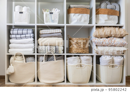 Domestic textile bed linen neatly placed cupboard shelves minimalism Nordic storage method 95802242