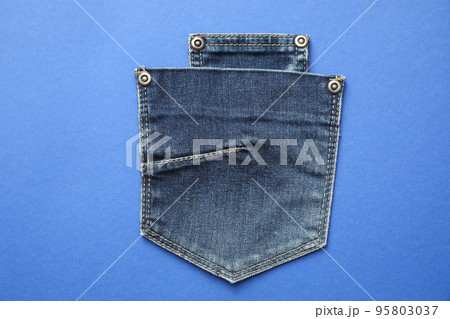 Stylish jeans pockets on blue background, top view Stylish jeans pockets on blue background, top view 95803037